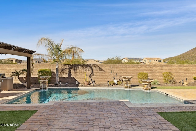 view of pool featuring pool water feature