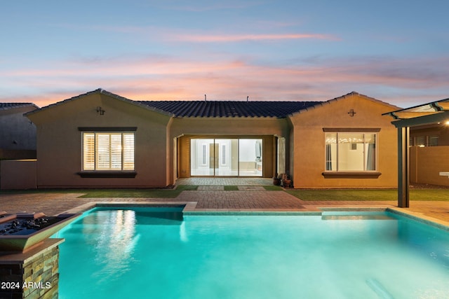 12860 W Calle De Sol, Peoria, AZ 85383 - back of property featuring an outdoor pool, stucco siding, and a patio