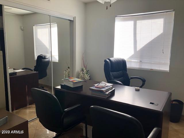 office space featuring light tile floors