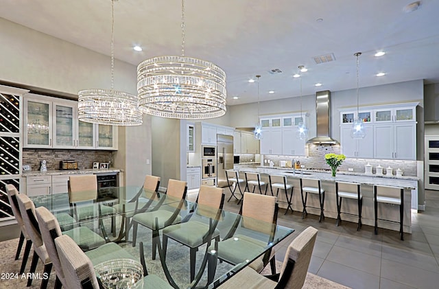 tiled dining space with a notable chandelier