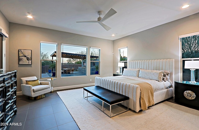 bedroom with tile patterned floors and ceiling fan