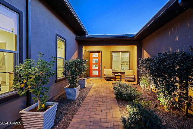 doorway to property with a patio