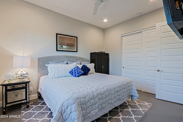 bedroom with ceiling fan and a closet