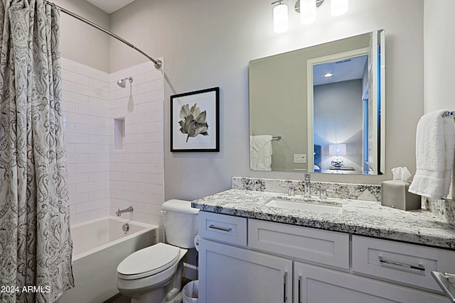 full bathroom featuring shower / tub combo with curtain, vanity, and toilet