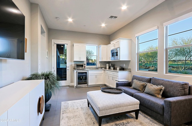 tiled living room with beverage cooler