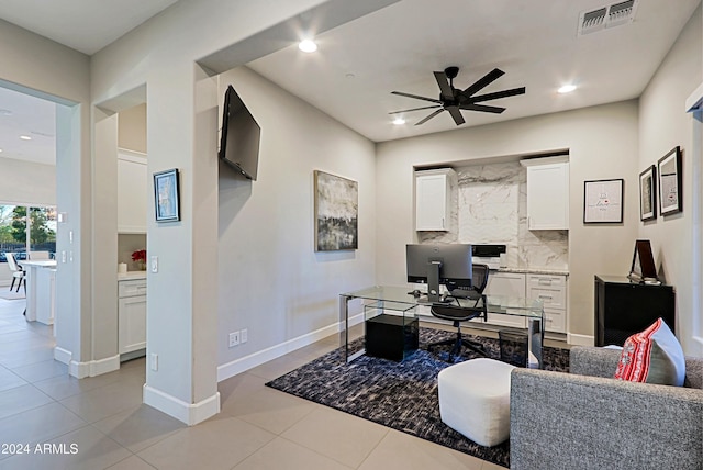 office with light tile patterned floors and ceiling fan