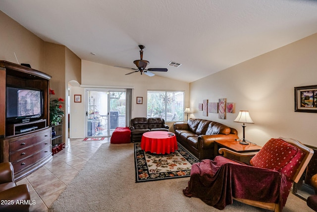 tiled living room featuring vaulted ceiling and ceiling fan