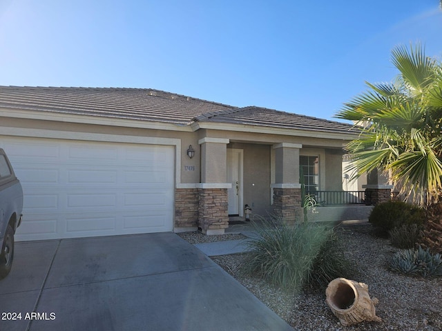 view of front of house with a garage and a porch