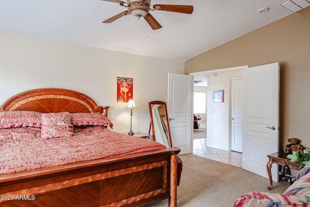 bedroom featuring lofted ceiling, light colored carpet, and ceiling fan