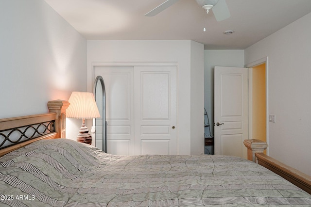 bedroom featuring ceiling fan and a closet