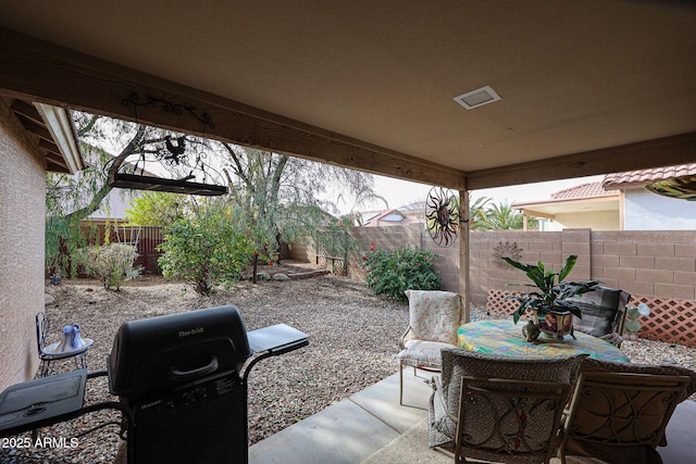 view of patio featuring a grill