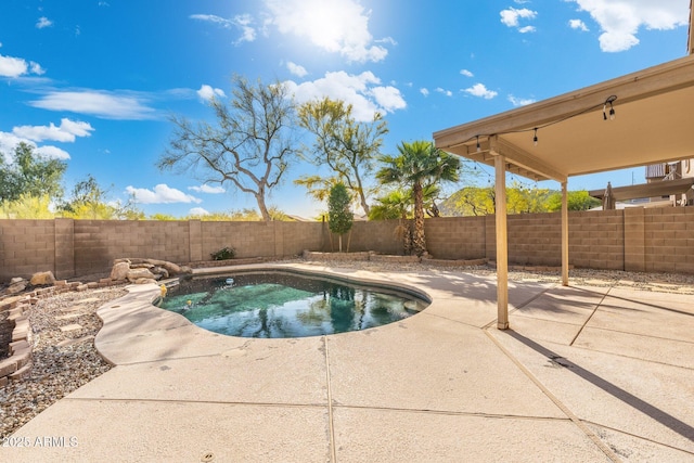 view of swimming pool featuring a patio area and a fenced backyard
