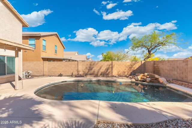 view of pool featuring a patio, a fenced backyard, and a fenced in pool