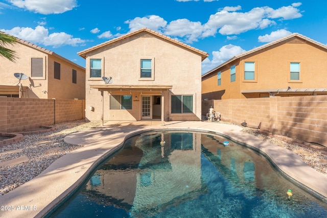 view of swimming pool featuring a patio, a fenced backyard, and a fenced in pool