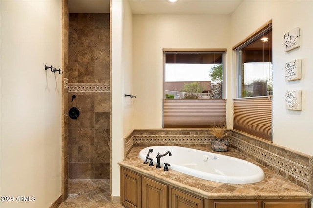 bathroom with separate shower and tub