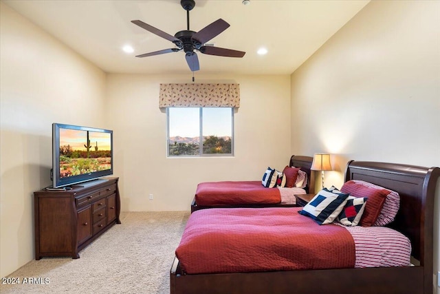 bedroom with light carpet and ceiling fan