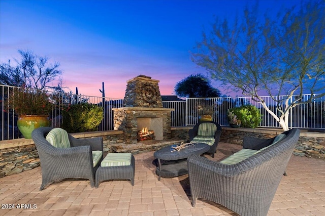 view of patio terrace at dusk