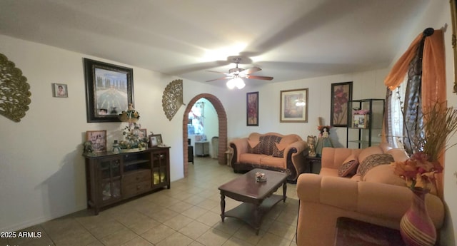 417 N 38th Ave, Phoenix, AZ 85009 - living room featuring arched walkways, a ceiling fan, and light tile patterned floors