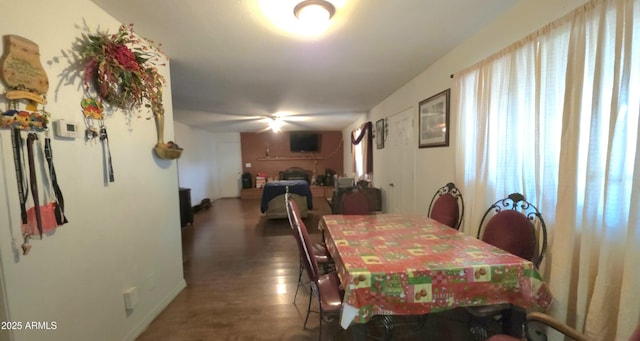 417 N 38th Ave, Phoenix, AZ 85009 - dining area featuring baseboards and a fireplace