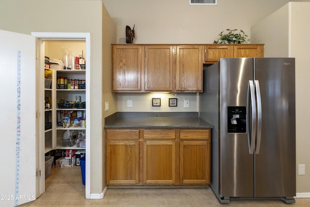 kitchen with stainless steel fridge with ice dispenser