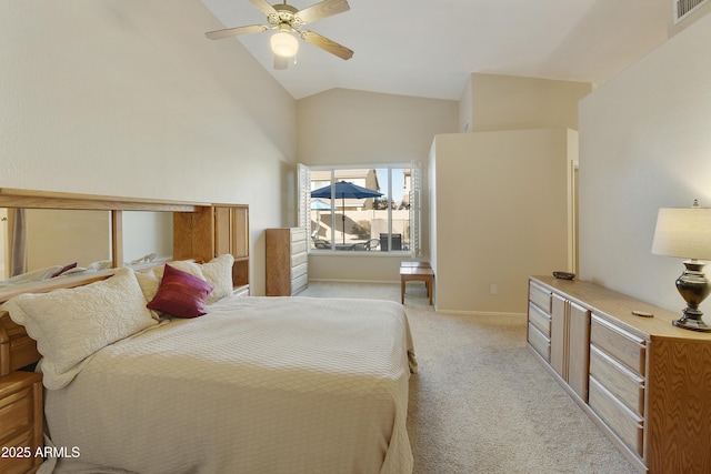 carpeted bedroom featuring ceiling fan and vaulted ceiling