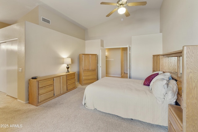 bedroom featuring lofted ceiling, light carpet, and ceiling fan