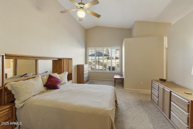 bedroom featuring ceiling fan, vaulted ceiling, and light colored carpet