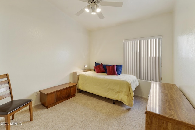 bedroom featuring light carpet and ceiling fan