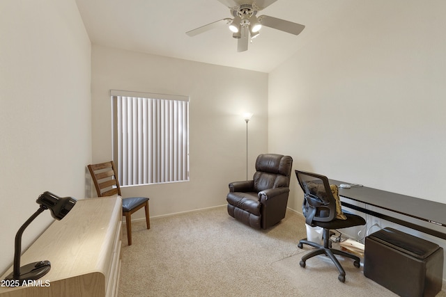 carpeted home office featuring ceiling fan