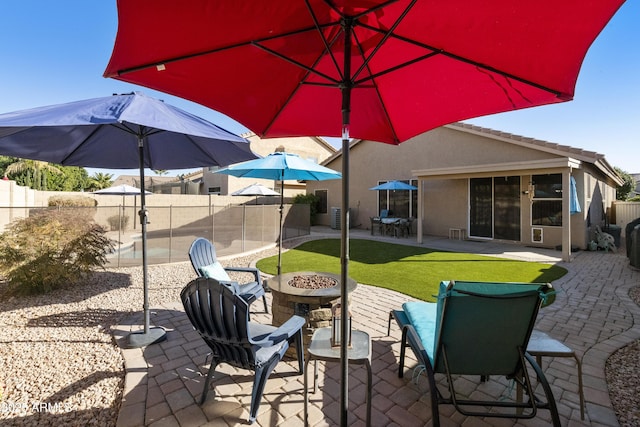 view of patio / terrace with an outdoor fire pit