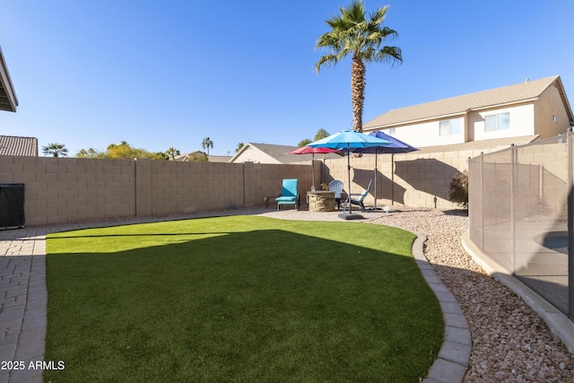 view of yard with a fire pit and a patio area