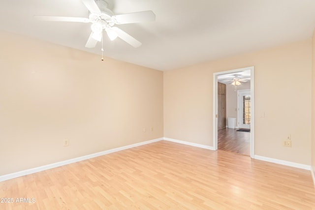 spare room featuring ceiling fan and light wood-type flooring