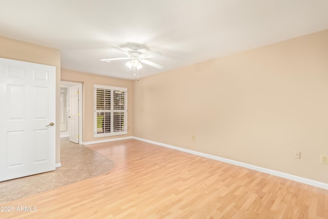 unfurnished room featuring ceiling fan and light hardwood / wood-style floors