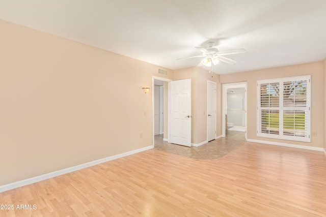 unfurnished room featuring ceiling fan and light hardwood / wood-style flooring