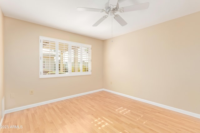 spare room with ceiling fan and light hardwood / wood-style flooring