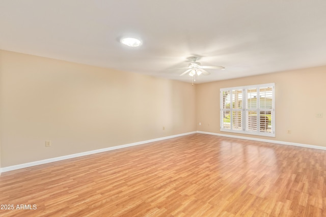 unfurnished room featuring light hardwood / wood-style floors and ceiling fan