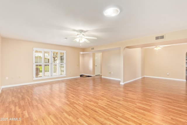 spare room featuring ceiling fan and light hardwood / wood-style floors