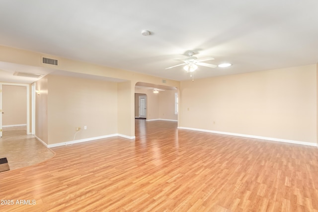 unfurnished room with ceiling fan and light wood-type flooring