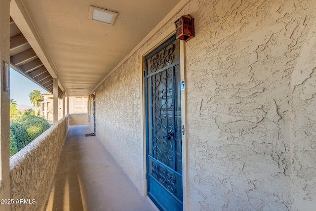 property entrance with stucco siding