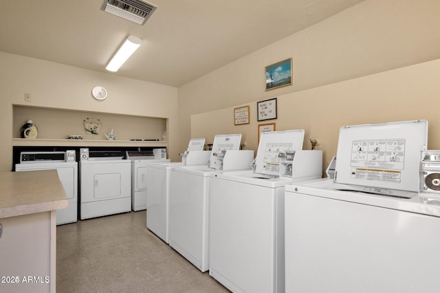 shared laundry with washing machine and clothes dryer