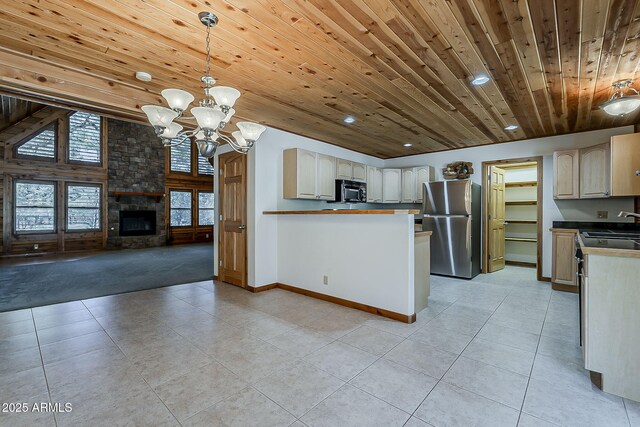 2793 Canyon Ridge Rd, Overgaard, AZ 85933 - kitchen featuring open floor plan, baseboards, a chandelier, wood ceiling, and appliances with stainless steel finishes