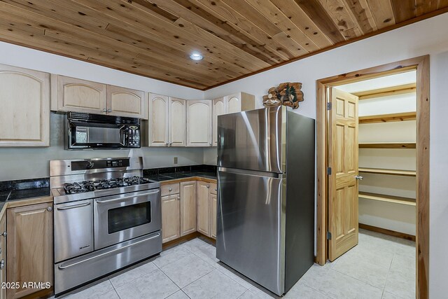 2793 Canyon Ridge Rd, Overgaard, AZ 85933 - kitchen featuring tile counters, appliances with stainless steel finishes, wood ceiling, light brown cabinets, and light tile patterned floors