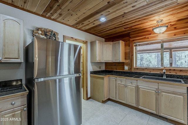 2793 Canyon Ridge Rd, Overgaard, AZ 85933 - kitchen featuring a sink, tile countertops, light tile patterned floors, wood ceiling, and freestanding refrigerator