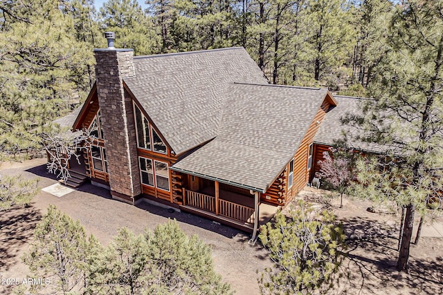 2793 Canyon Ridge Rd, Overgaard, AZ 85933 - exterior space with a shingled roof, a chimney, and a deck