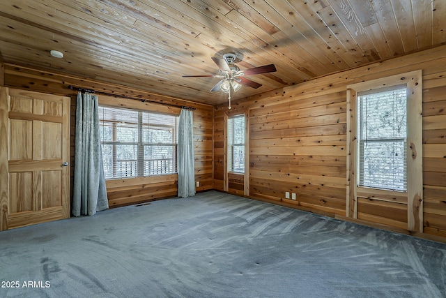 2793 Canyon Ridge Rd, Overgaard, AZ 85933 - carpeted empty room with ceiling fan, wooden ceiling, and wood walls