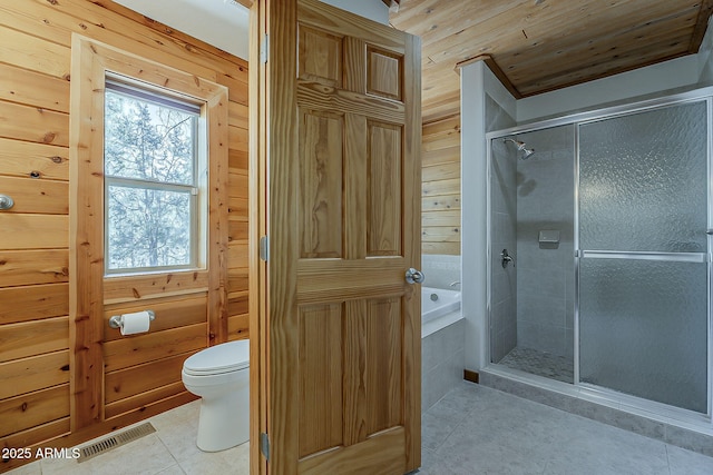 2793 Canyon Ridge Rd, Overgaard, AZ 85933 - bathroom with wooden walls, tile patterned floors, visible vents, and a stall shower