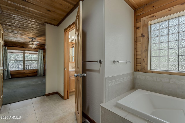 2793 Canyon Ridge Rd, Overgaard, AZ 85933 - bathroom with a garden tub, wood ceiling, ceiling fan, baseboards, and tile patterned flooring