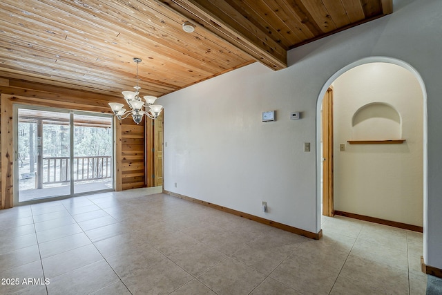 2793 Canyon Ridge Rd, Overgaard, AZ 85933 - unfurnished room featuring an inviting chandelier, wooden ceiling, arched walkways, and light tile patterned floors