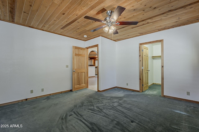 2793 Canyon Ridge Rd, Overgaard, AZ 85933 - carpeted empty room featuring wood ceiling, ceiling fan, arched walkways, and baseboards