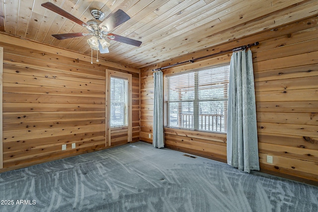 2793 Canyon Ridge Rd, Overgaard, AZ 85933 - carpeted empty room featuring wooden walls, a wealth of natural light, wooden ceiling, and visible vents